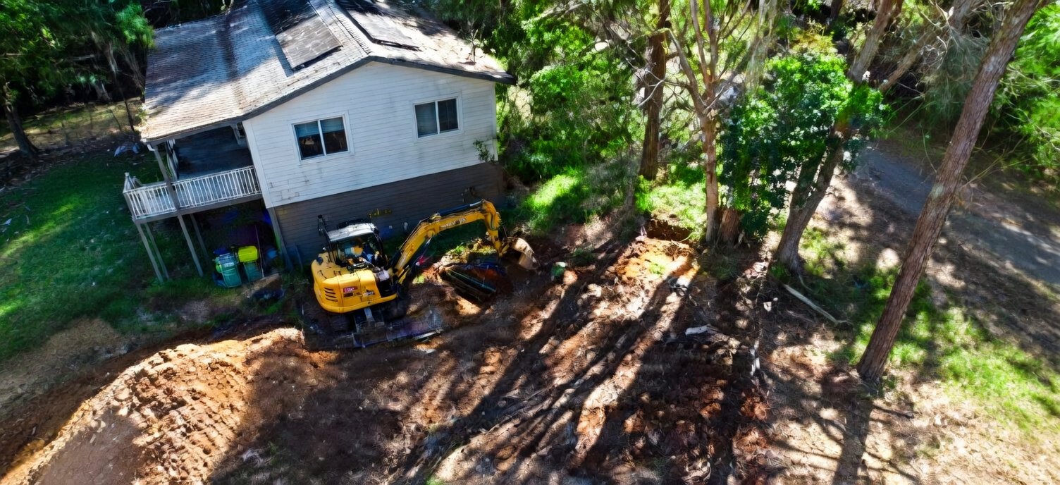 Excavation and property preparation for a septic installation on Macleay Island